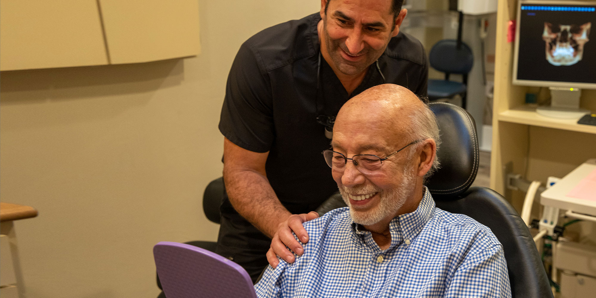 patient and doctor smiling brightly after dental procedure information